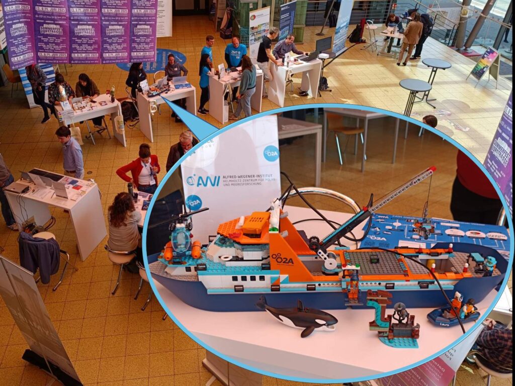 Picture collage. Background: View into the glass hall with exhibitors. Foreground as an oval speech bubble: Detail of the research ship Polarstern made of Lego, including orca whale and dinghies at the Alfred Wegener Institute booth.